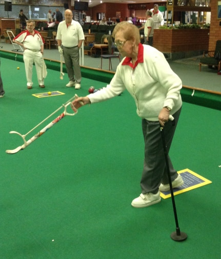 contact us - Using bowls arm and ferruled walking stick